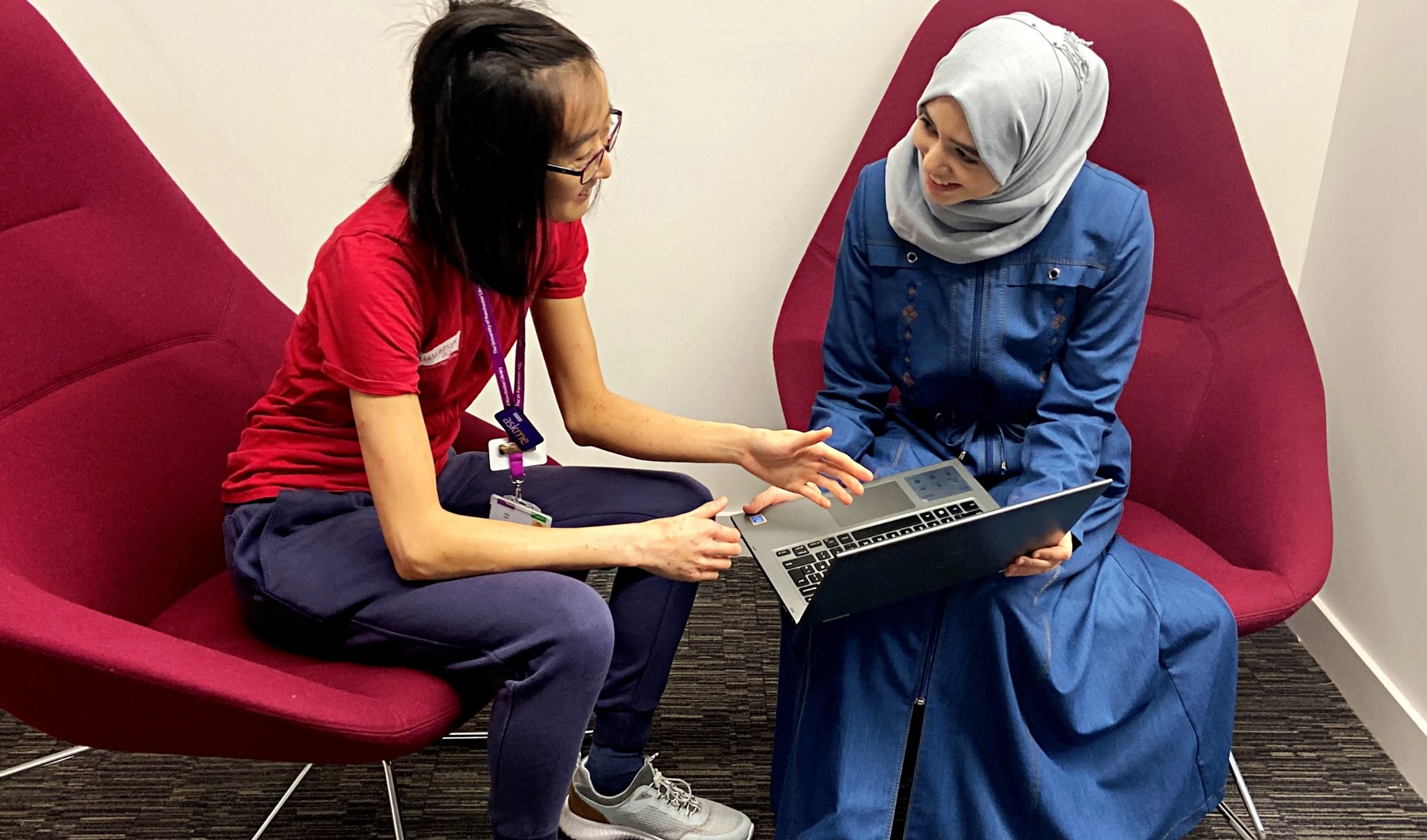 Students chatting over laptop
