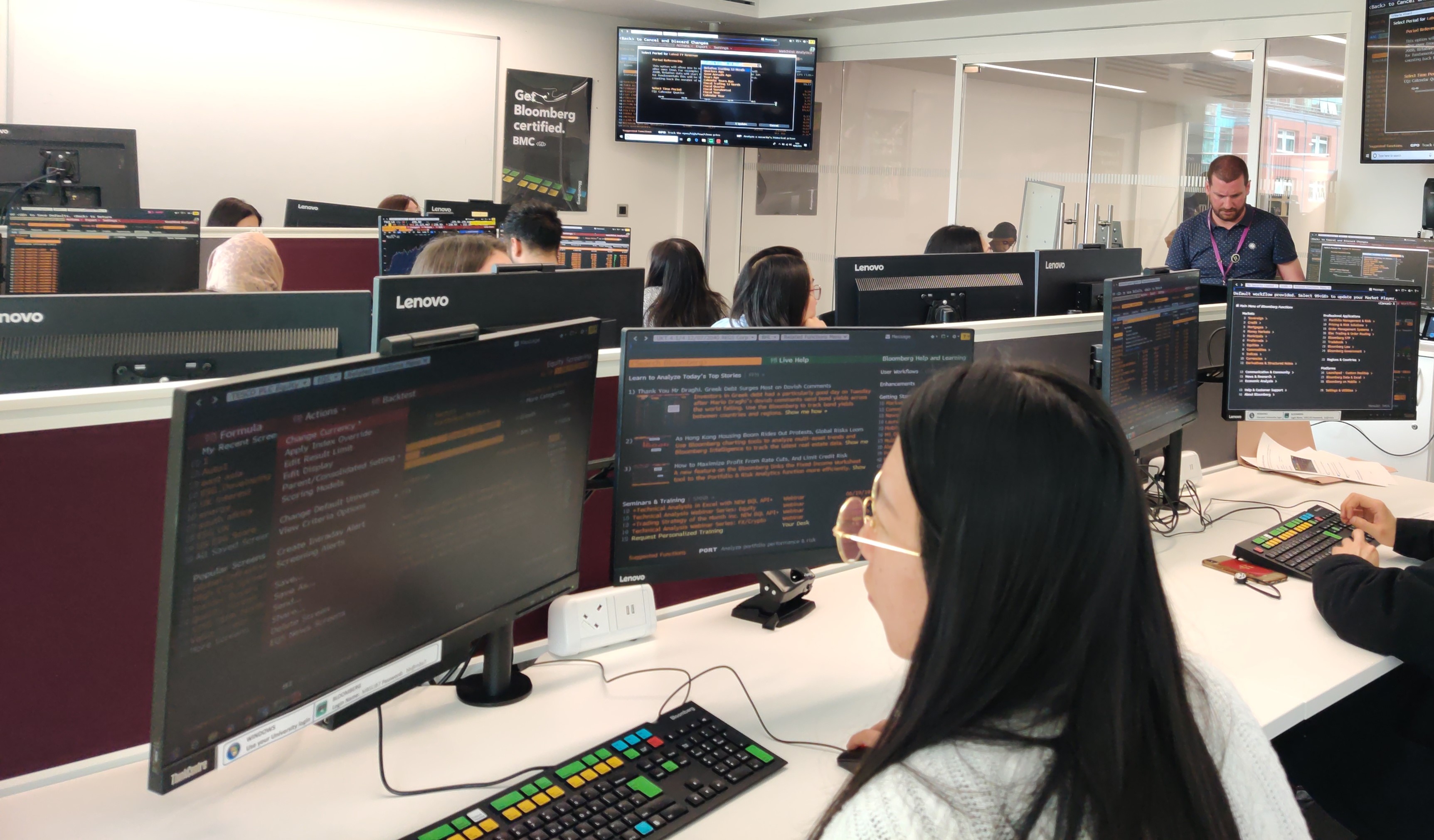 Person using a pc in the finance zone at the business school.